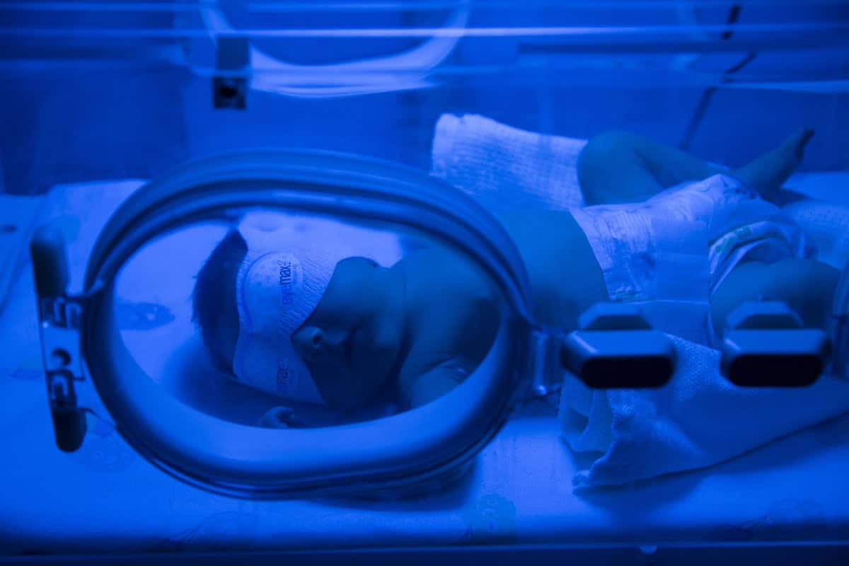 Newborn baby having UVB treatment for jaundice