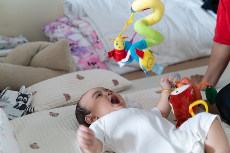 Baby enjoy playing with bright toys